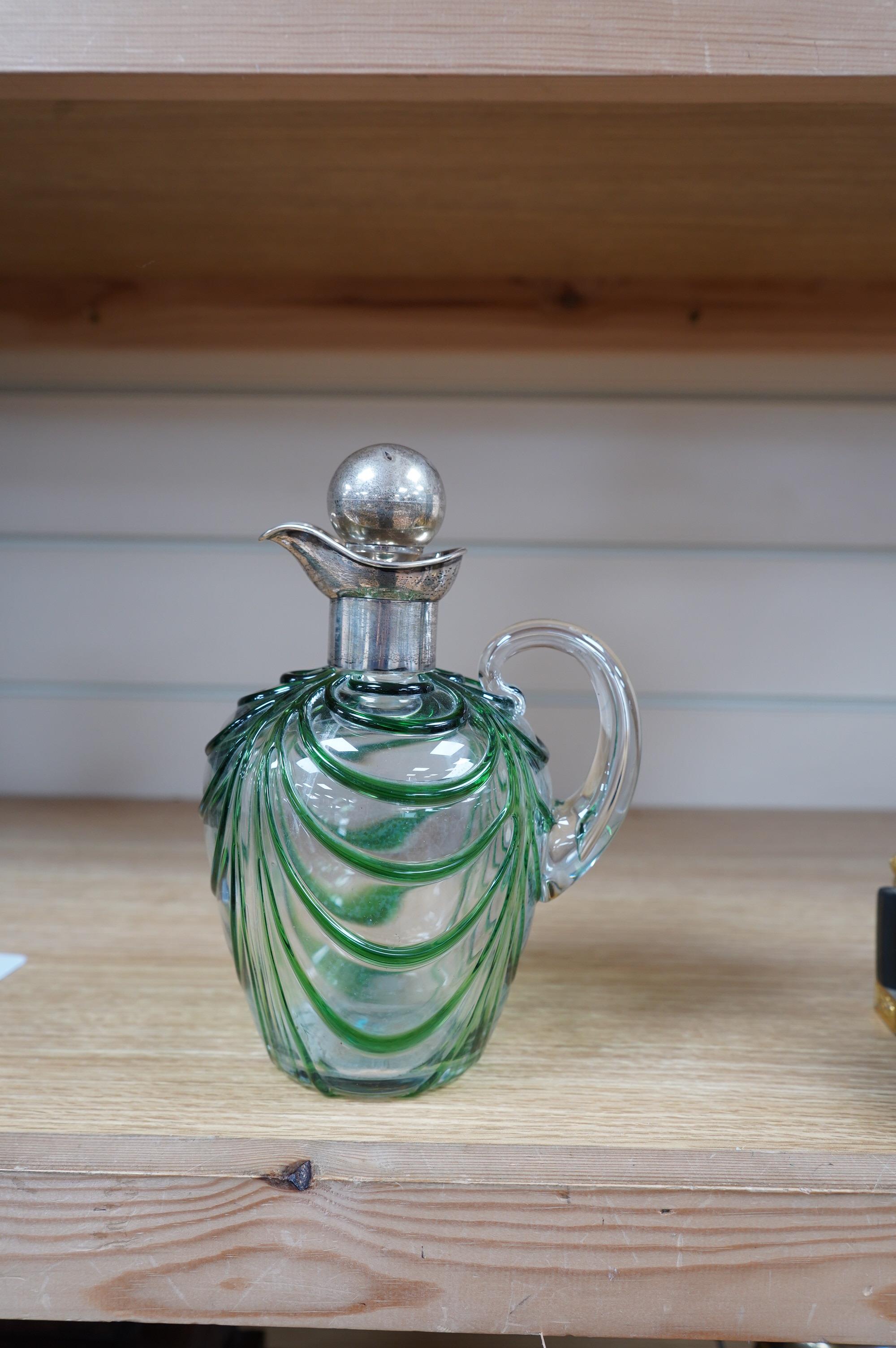 An Art Nouveau silver mounted green overlaid glass liqueur jug, David & Maurice Davis, Birmingham 1904, 20cm high. Condition - good